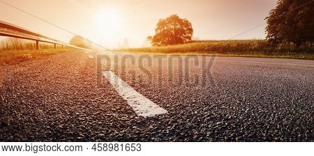 Black Asphalt Road And White Dividing Lines