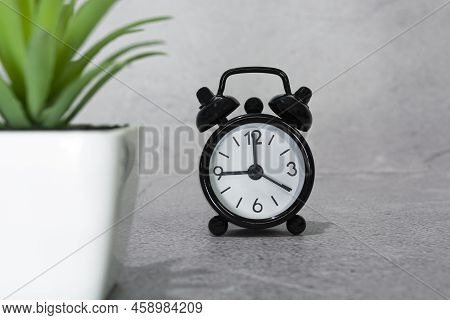 Black Alarm Clock Isolated. The Clock Set At 9 Oclock. Deadline Concept.