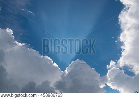 Beam Of Light Through The Clouds. Rays Of Light Shining Through Clouds. Ultraviolet Rays Concept.