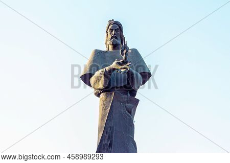 Dushanbe, Tajikistan - July 20, 2022: Statue Of Persian Poet Ferdowsi In The Park Against The Blue S