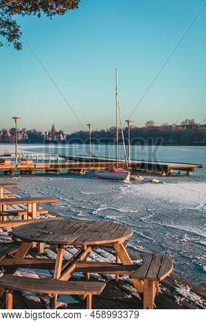 Sailing Boat, Yacht Waiting For The Summer At Frozen Port, Hamburg, Aussenalster In Winter