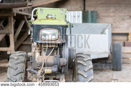 Typical Heavy Diesel Walking Tractor With Trailer. Agricultural Transport Equipment Of The Countrysi