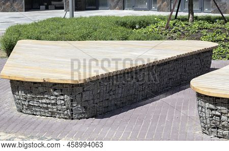 Wooden Benches From Gabion Baskets With Stones Inside. Wood Mounted On Gabions. Benches Of Modern De