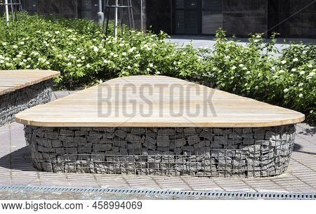 Wooden Benches From Gabion Baskets With Stones Inside. Wood Mounted On Gabions. Benches Of Modern De