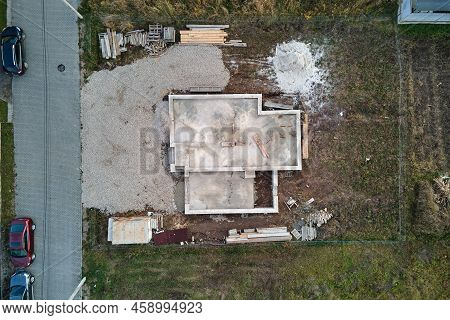 Aerial View Of Building Works Of New House Concrete Foundation On Construction Site