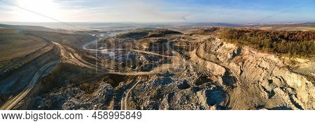 Aerial View Of Open Pit Mine Of Sandstone Materials For Construction Industry With Excavators And Du