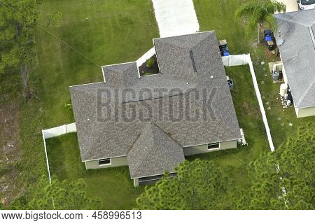 Aerial View Of Typical Contemporary American Private House With Roof Top Covered With Asphalt Shingl