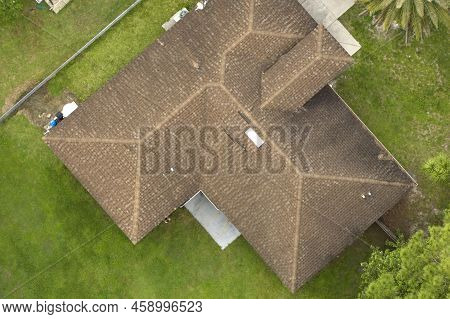 Aerial View Of Typical Contemporary American Private House With Roof Top Covered With Asphalt Shingl