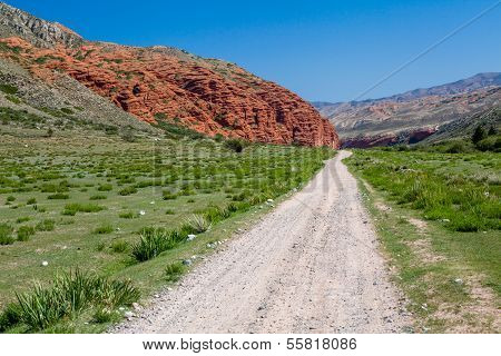 Dirt road along amazing rock formations