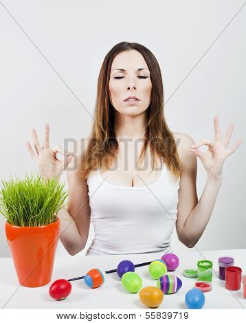 Relaxed girl and painted eggs