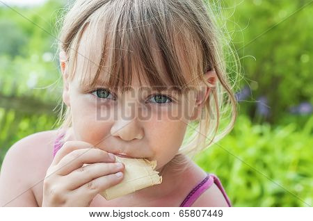 Beautiful Little Girl Eating Ice Cream
