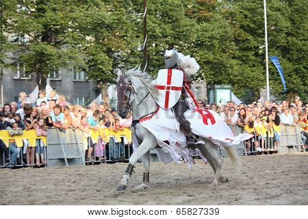 Riga, Latvia - August 21: Member Of The Devils Horsemen Stunt Team Riding White Horse During Riga Fe