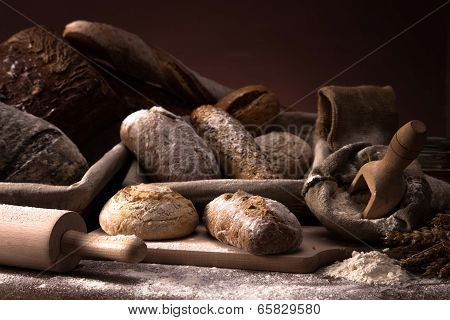 Fresh Bread And Wheat On The Wooden Table