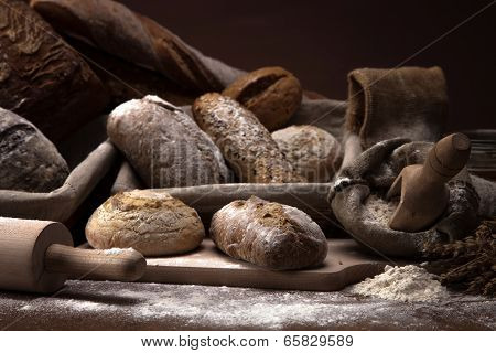 Fresh Bread And Wheat On The Wooden Table