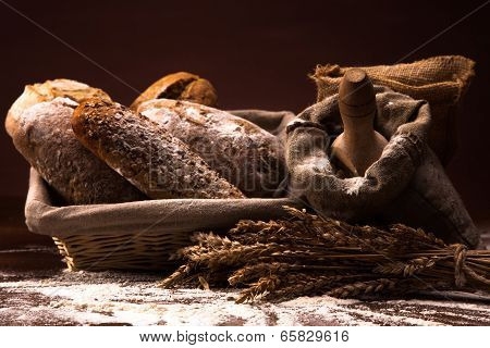 Fresh Bread And Wheat On The Wooden Table
