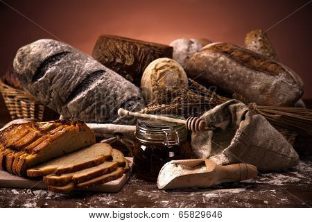 Fresh Bread And Wheat On The Wooden Table