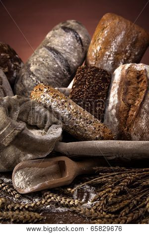 Fresh Bread And Wheat On The Wooden Table