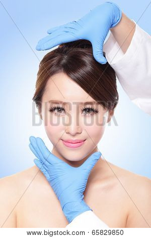 Female face with plastic surgery glove