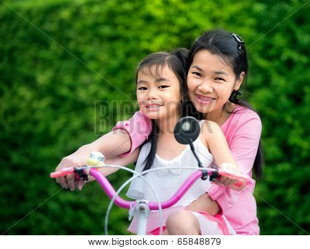 Mother And Chikd With Bicycle