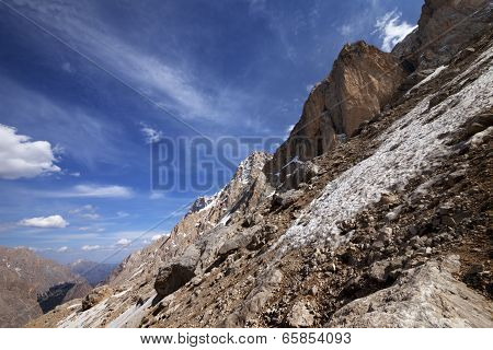Rocks With Snow At Sun Day