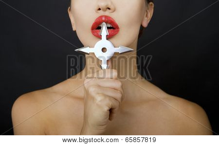 Beautiful Girl Holding A Shuriken