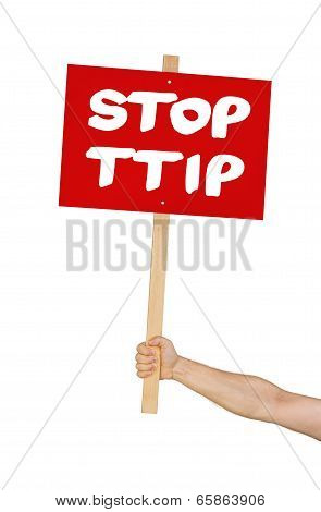 Person holding a sign saying Stop TTIP