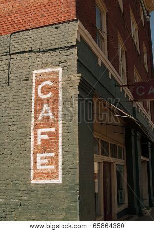 Cafe sign on historic brick building