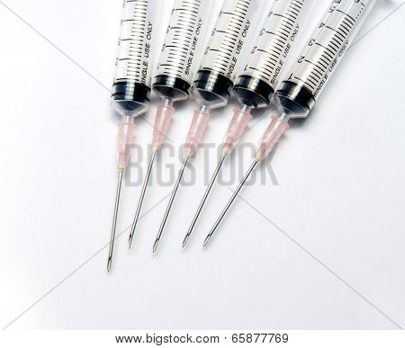 Close up medical syringe in row