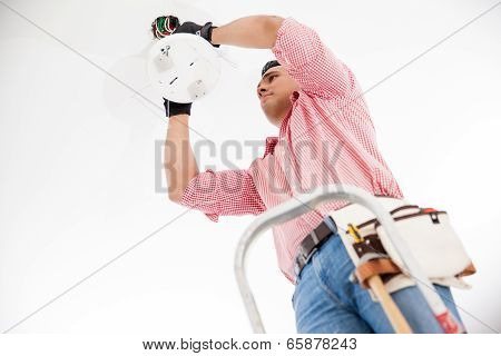 Electrician Installing A Lamp