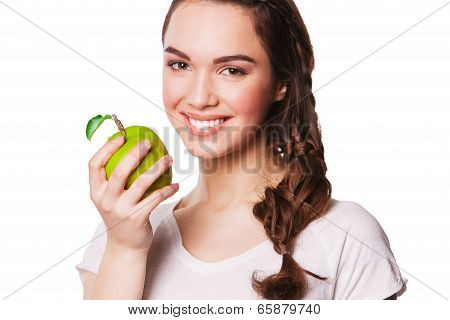 young woman with a green apple on her hand