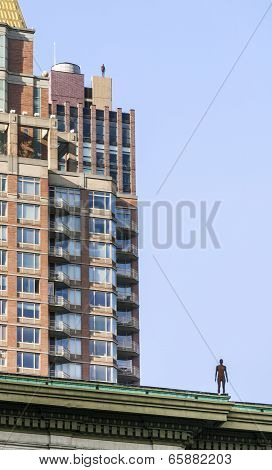 Statue Of Man From Artist Antony Gormley On The Roof