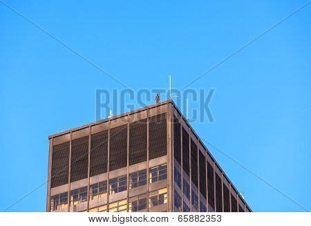 Iron Statue Of Man From Artist Antony Gormley On The Roof Of A Manhattan Skyscraper