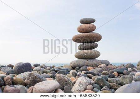 Zen Stones balance, pebbles stack over blue sea