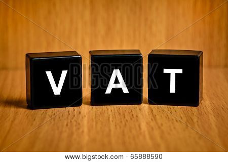 Vat Or Value Added Tax Word On Black Block