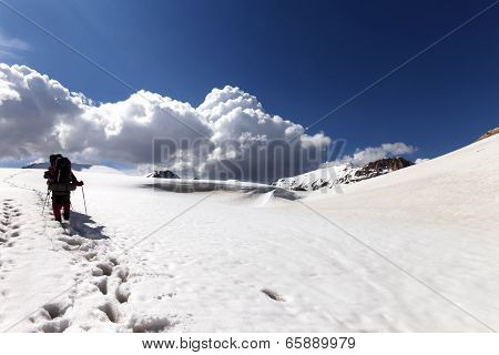 Two Hikers On Snowy Plateau