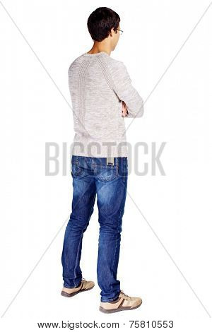Full length half turn back view portrait of man in glasses and beige sweater with crossed arms on his chest isolated on white background