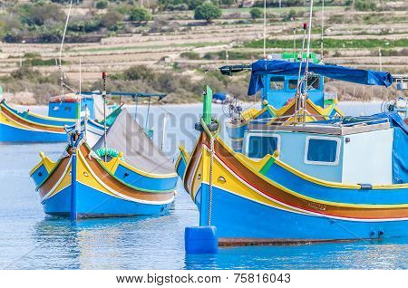 Traditional Luzzu Boat At Marsaxlokk Harbor In Malta.