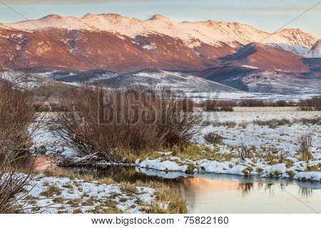 dusk over Canadian River and Medicine Bow Mountains in North Park near Walden, Colorado, late fall scenery