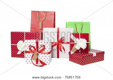 Stack of Christmas gifts and giftbags isolated on white background 