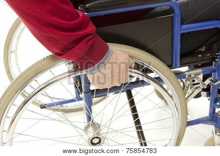 Wheelchair user makes various movements with his wheelchair, exercises for safety handling
