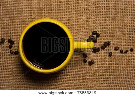 Coffee Mug Closeup - Top View With Beans