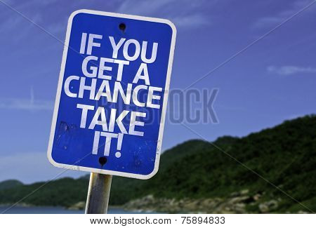 If You Get a Chance, Take It! sign with a beach on background