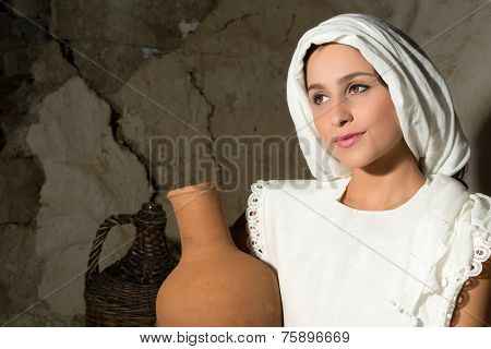 Biblical portrait of a woman depicting mother Mary holding a wine jug