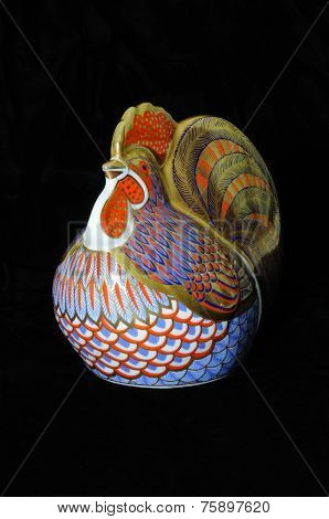 Painted cockerel paperweight.