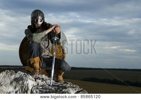 Knight Sitting On A Rock