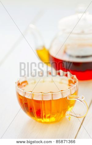 Cup Of Hot Tea Kettle On The Table