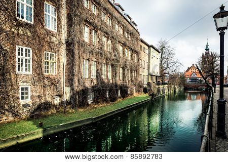 canal and old historic buildings in the old town of Gdansk, Poland