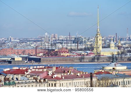 ST. PETERSBURG, RUSSIA - MARCH 5, 2015: Spire of Peter and Paul Cathedral over the cityscape. Built between 1712 and 1733, it is the first and oldest landmark in St. Petersburg