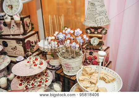 Wedding decoration with pastel colored cupcakes, meringues, muffins and macaroons