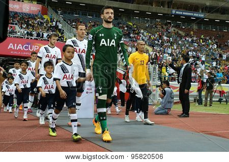 May 27, 2015 - Shah Alam, Malaysia: Tottenham Hotspur's captain Hugo Lloris (green jersey) leads his team out into the field in a friendly match. Tottenham Hotspur is on a Asia-Australia tour.
